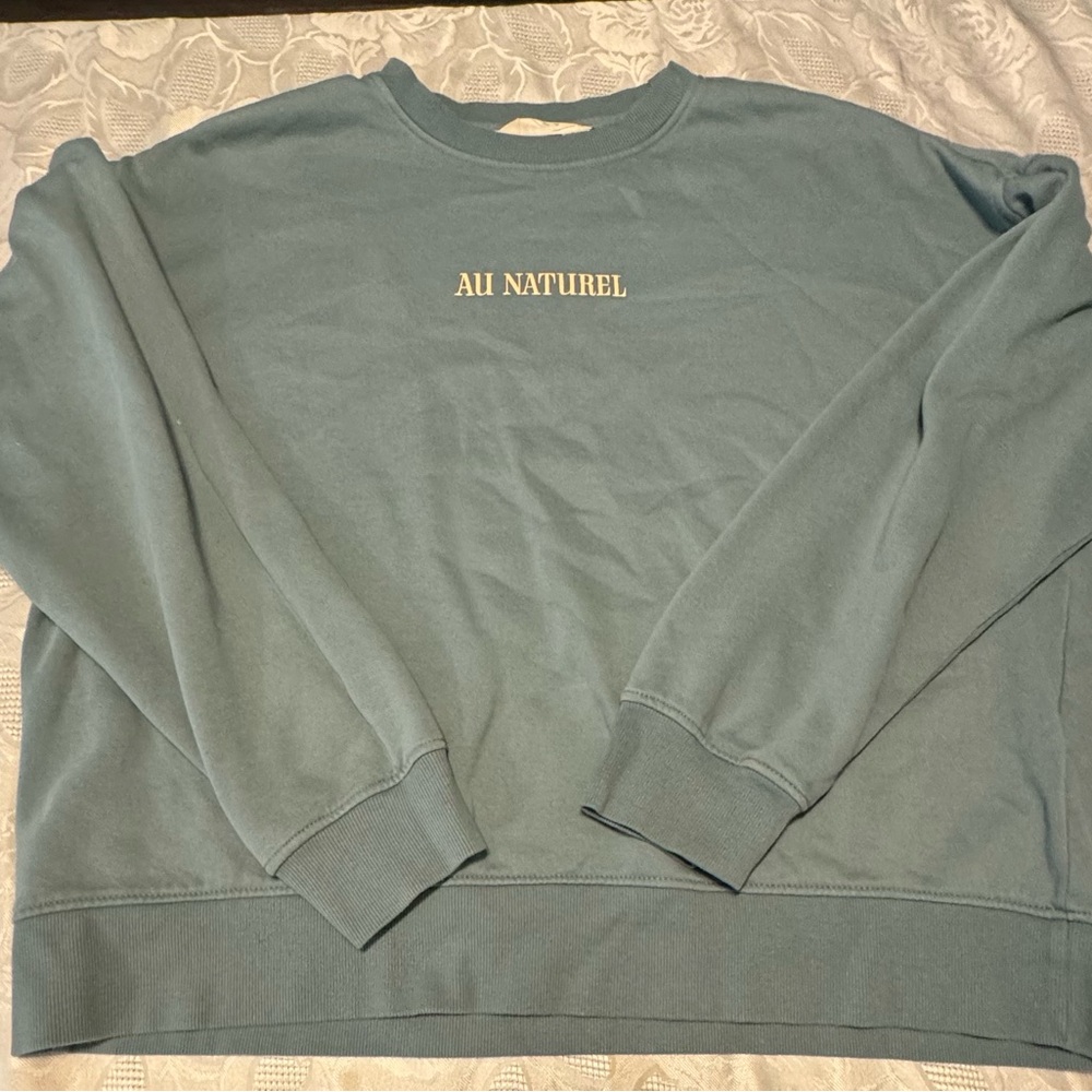 All green sweatshirt with words that say all natural size is Medium